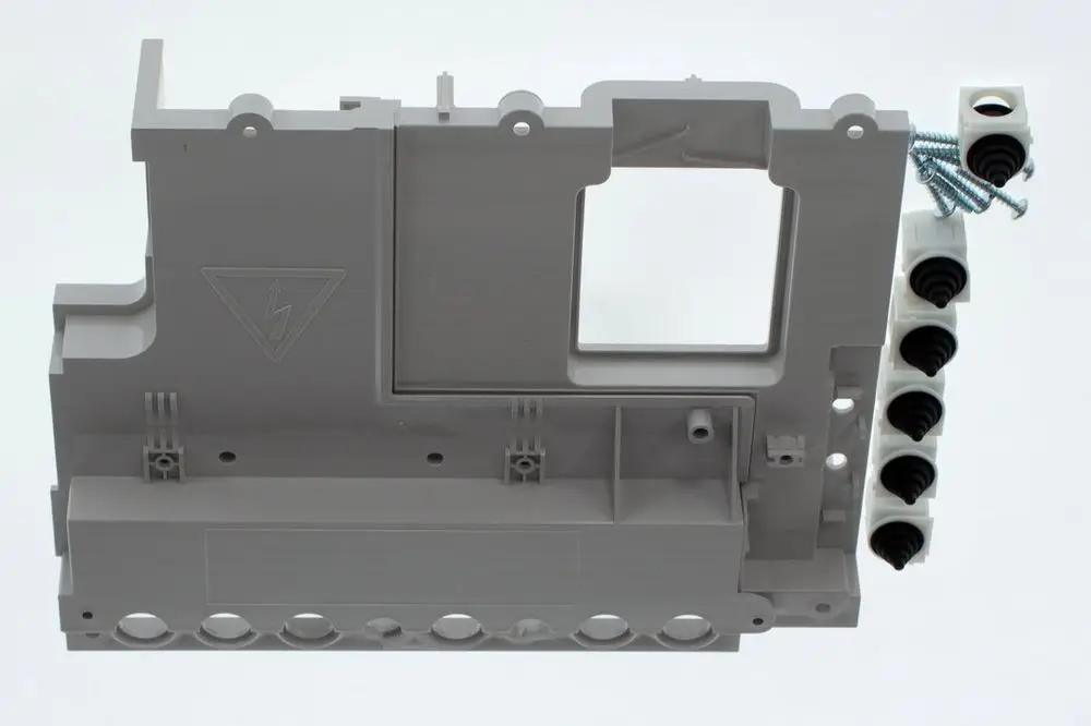 Grau gefärbtes Kunststoffbauteil mit Anschlussmöglichkeiten und einem Symbol für elektrische Sicherheit, geeignet für BOSCH-Geräte.